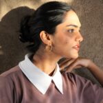 Minimalist gold hoop earrings "Solace" styled on model, geometric circle bar design, modern statement jewelry by Masaira.