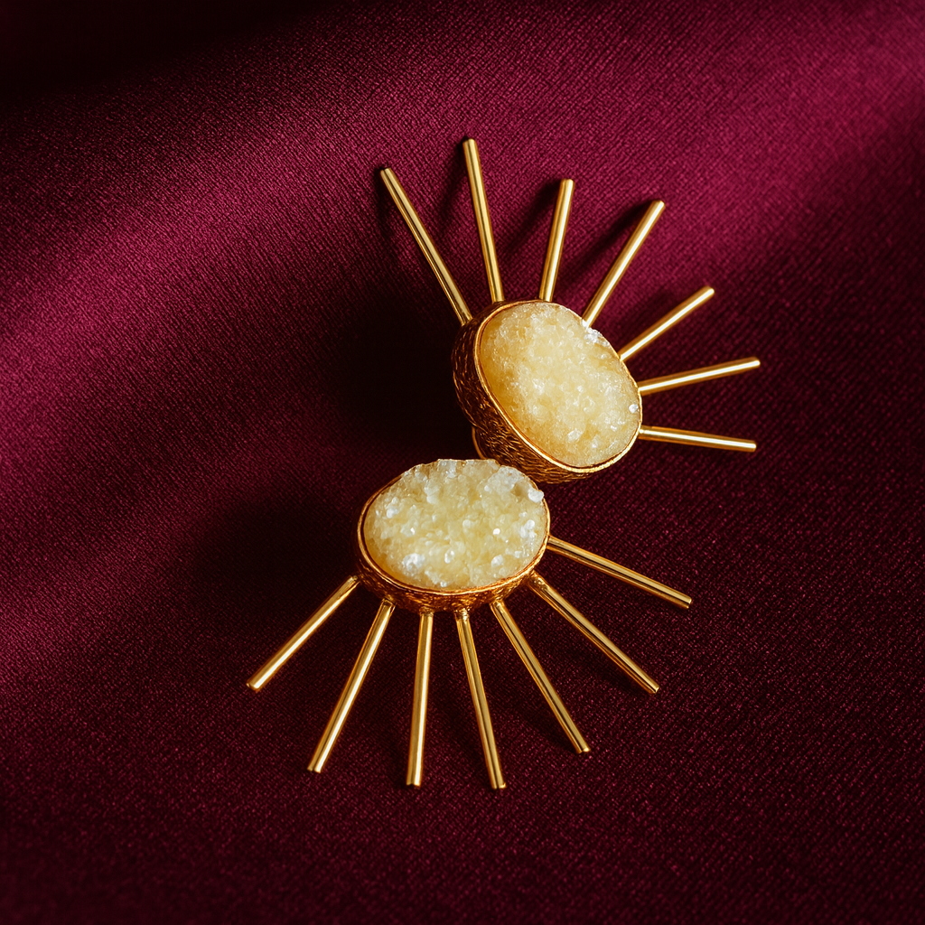 Keeyana Druzy Sunburst Gold-Plated Earrings | Masairarings masaira Masaira Keeyana gold-plated sunburst earrings with cream druzy stones on deep maroon satin