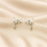Twilight Bloom 92.5 silver earrings with bow-shaped CZ tops and star drop charms, hypoallergenic and anti-tarnish — Masaira