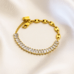 Gold link bracelet with baguette-cut zircon stones on satin background