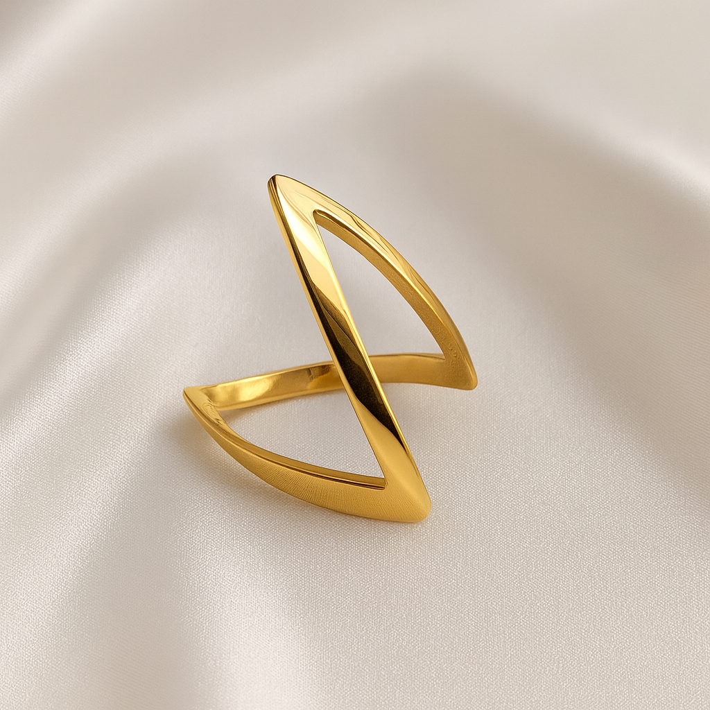 Orbit Gleam 18 Carat Gold Plated Ring – Masaira Sculptural open gold ring with bold modern design on satin background