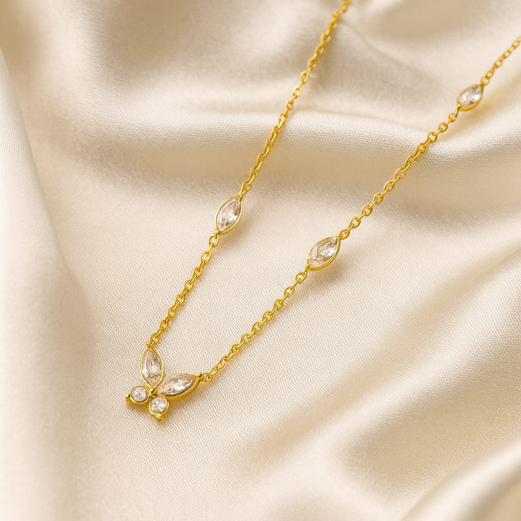 18 carat gold plated butterfly pendant necklace with cubic zirconia stones on satin background