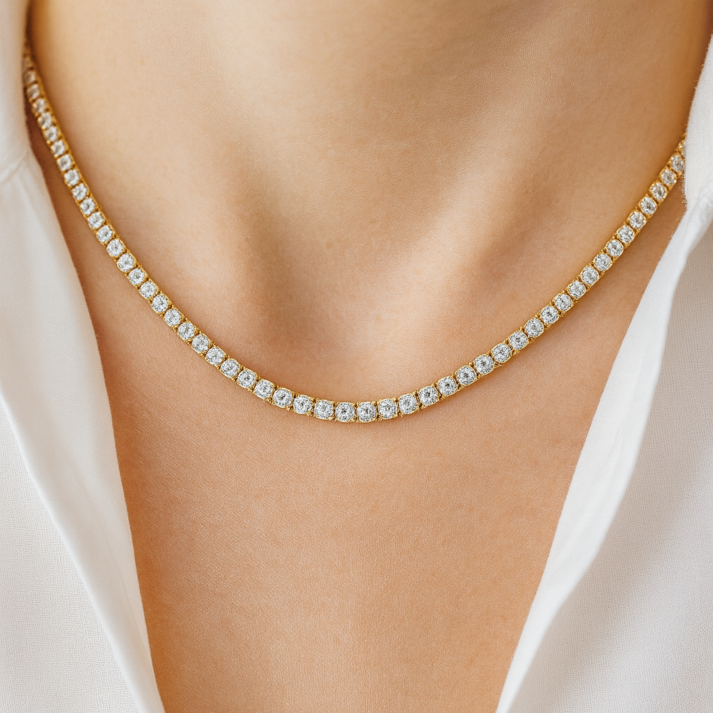 Model wearing 18 carat gold-plated tennis necklace with simulated diamonds