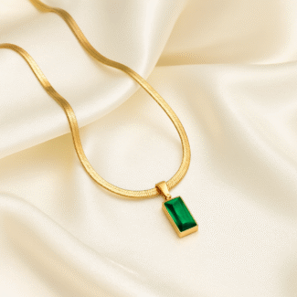 18 carat gold plated herringbone necklace with rectangular emerald green stone pendant