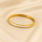 Kids’ gold plated bangle with baguette-cut stones in a sleek linear design
