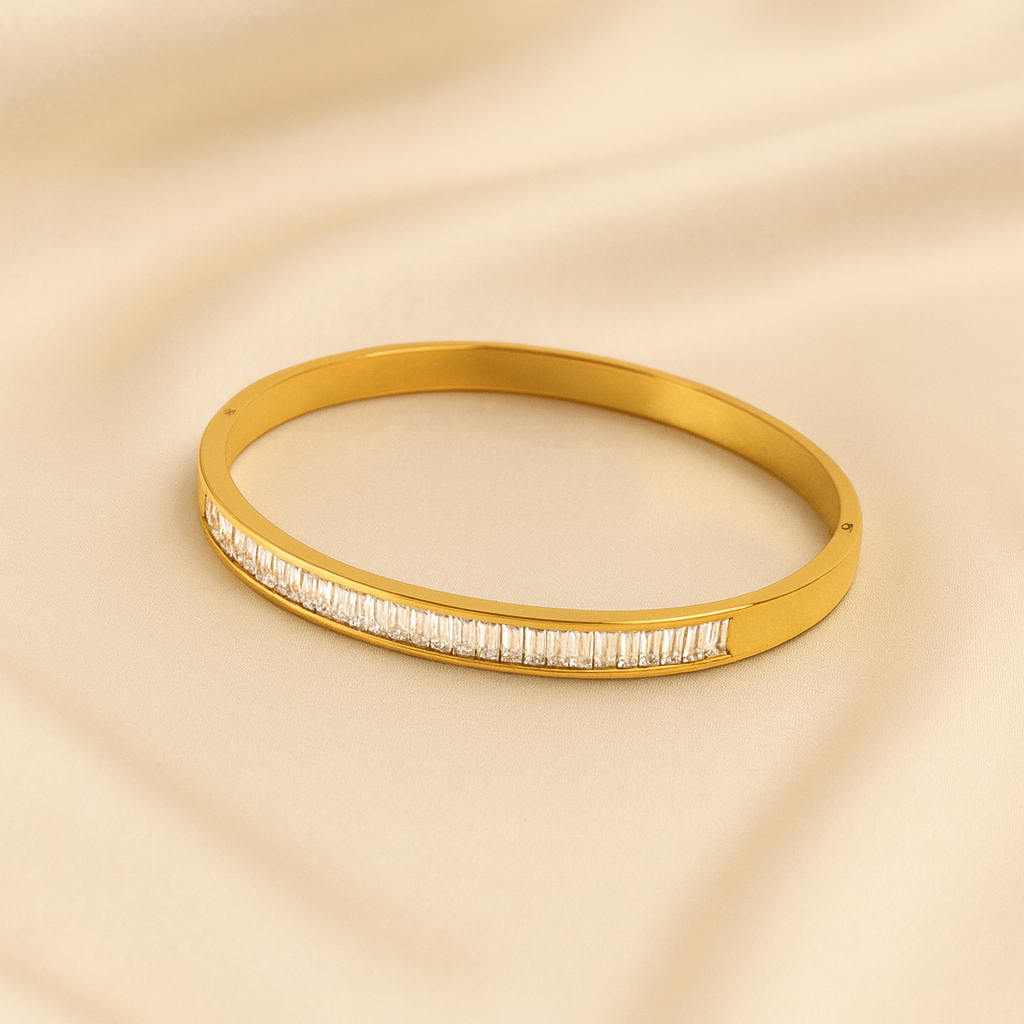 Kids’ gold plated bangle with baguette-cut stones in a sleek linear design