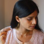 Minimalist ribbon gold-plated earrings styled with ethnic wear – lightweight contemporary jewelry for women.