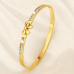 Elegant gold plated bow bangle with princess-cut stones for women