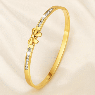 Elegant gold plated bow bangle with princess-cut stones for women