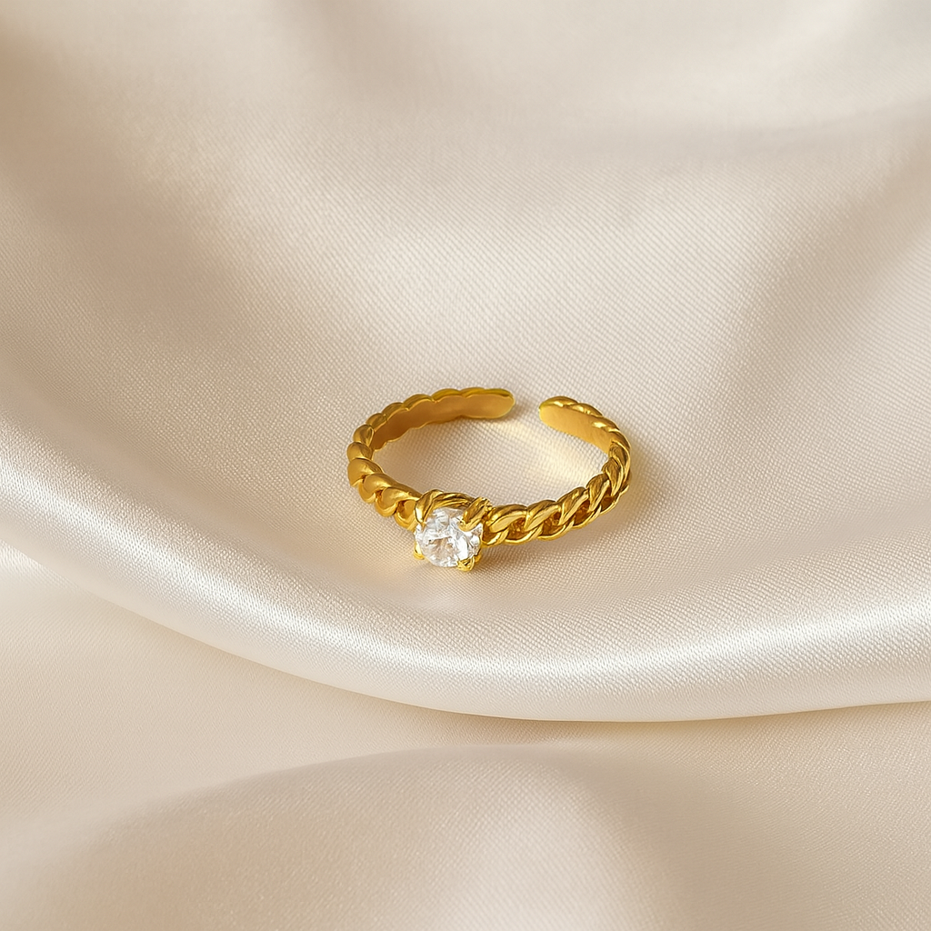 Twilight Twist Ring | 18 Carat Gold Plated Twisted Band Ring | Masaira Twilight Twist Ring in 18 carat gold with twisted band and zircon stone