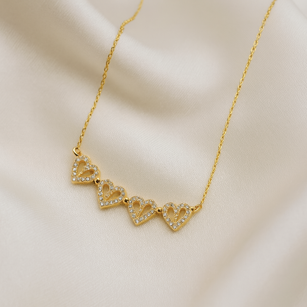 Magnetic Heart Cascade Necklace | 18 Carat Gold Plated Magnetic Heart Pendant | Masaira Magnetic Heart Cascade Necklace in 18 carat gold with cubic zirconia hearts and magnetic design