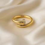 Bolt Luxe Ring in 18 carat gold with wrap-around nail-inspired design and CZ stones.