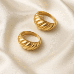 Aurora Swirl Dome Ring in 18 carat gold with sculpted swirl texture on a dome band.