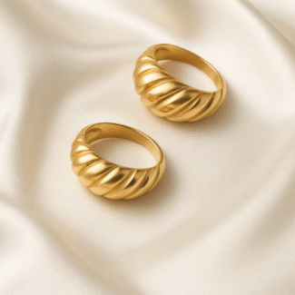 Aurora Swirl Dome Ring in 18 carat gold with sculpted swirl texture on a dome band.