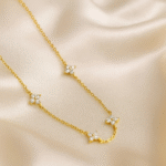 Celestial Bloom Station Necklace in 18 carat gold plating with CZ floral motifs.