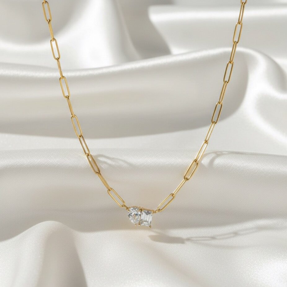 Dual Radiance Link Necklace | 18 Carat Gold Plated Minimal Pendant Dual Radiance Link Necklace with pear-cut and baguette-cut stones on an 18 carat gold-plated chain.
