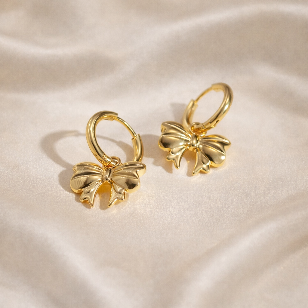 Gold bow hoop earrings in stainless steel with 18 carat gold plating, anti-tarnish and hypoallergenic